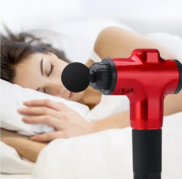 Red Fascia Gun Massage Gun placed near a sleeping woman, ideal for muscle relaxation and recovery in health and beauty care.